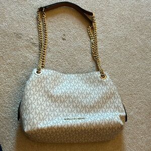 Michael Kors shoulder bag with chain straps. Approximate dimensions 10x7x4.